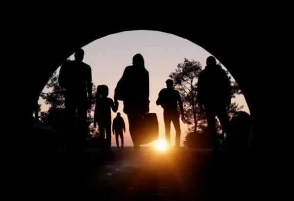 Silhouette of refugees and immigrants looking for a new hope in life